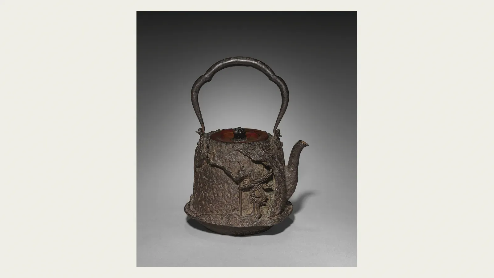 A black cast-iron tetsubin kettle modelled with a dragon