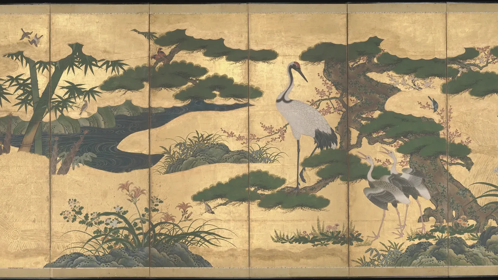 A gold folding screen painted with ancient pines