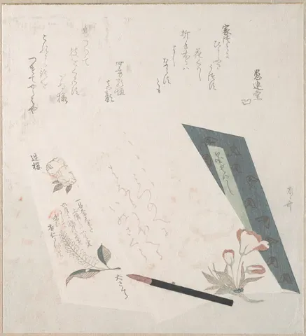 A writing brush beside a brushed poem