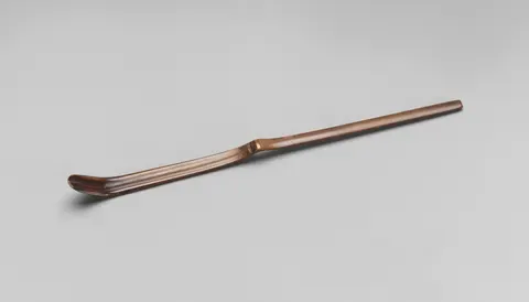 A slender bamboo tea scoop, the chashaku