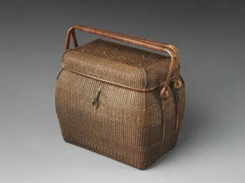 A finely woven travel basket for tea utensils